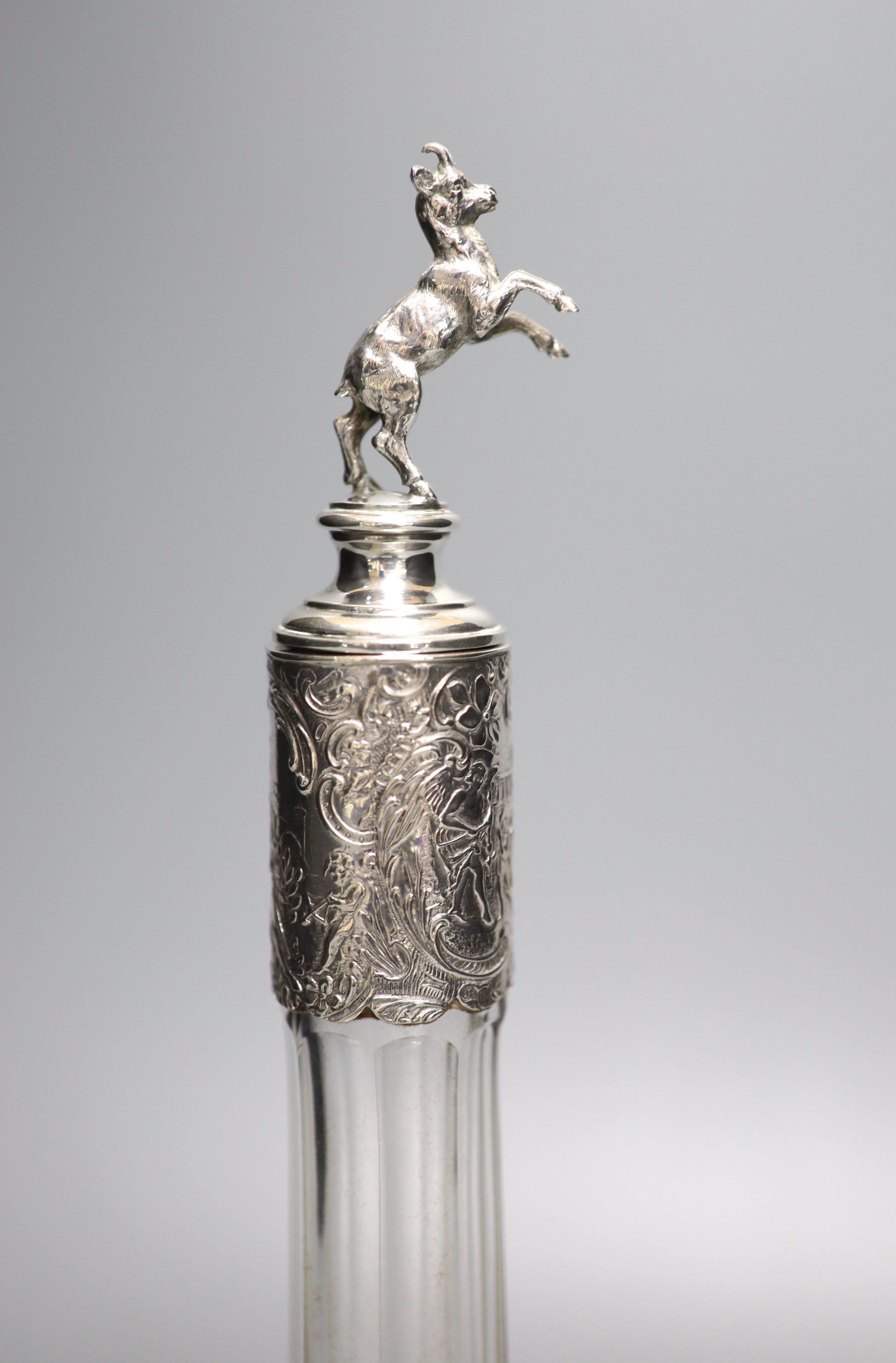 A late 19th/early 20th century Hanau? white metal mounted glass decanter, with rearing horse mounted stopper, 31.5cm